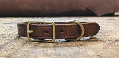 1" harness leather dog collar. Made from top quality harness leather . Solid brass hardware and nameplate. Up to 4 lines per plate with a maximum of 20 characters per line. Made in the USA.